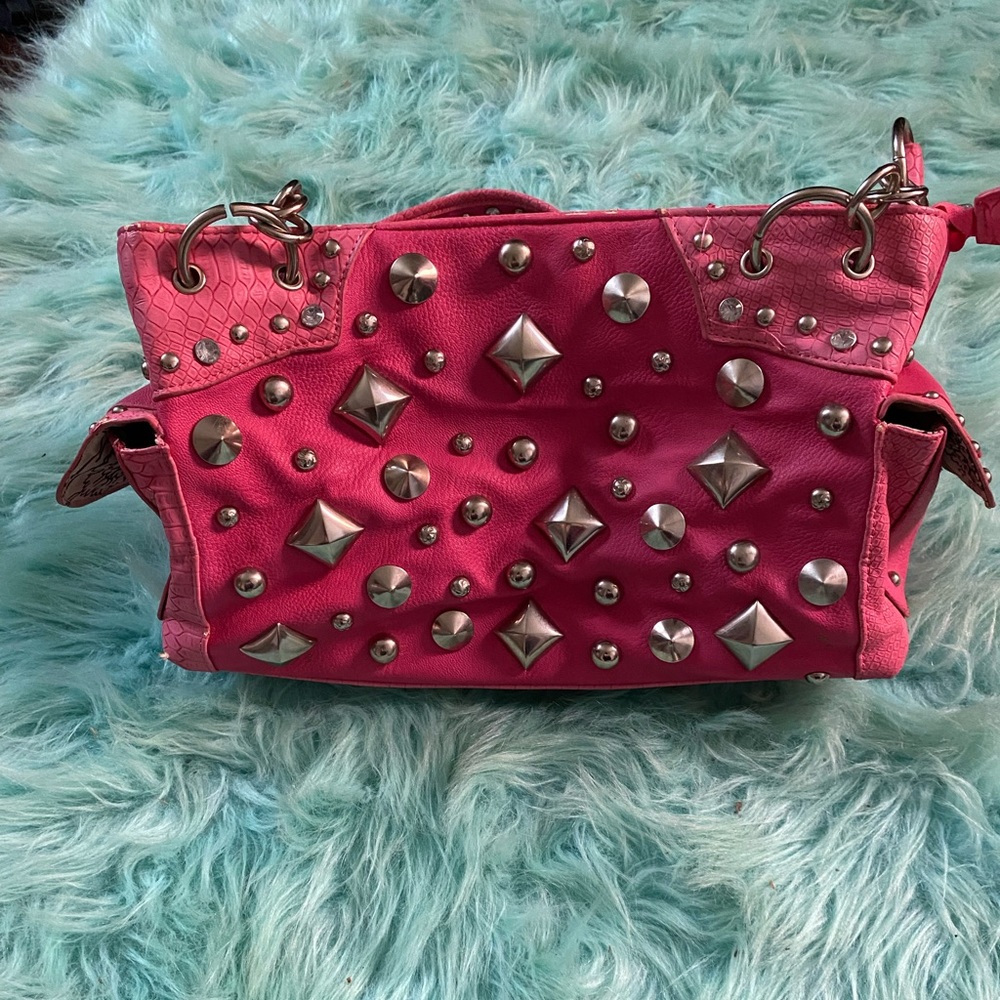 Hot pink studded leather bag